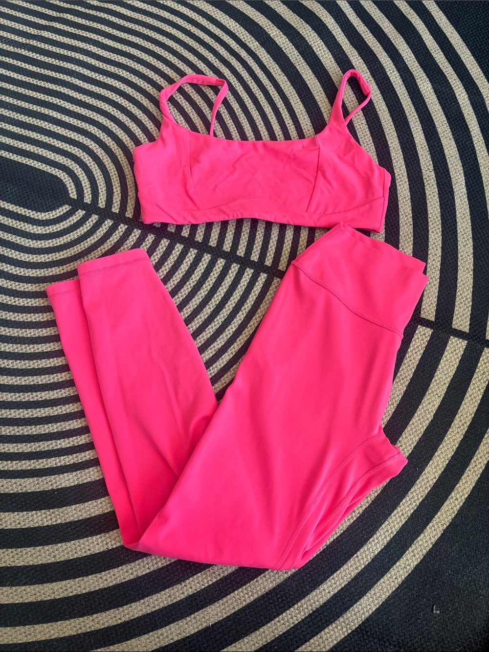Hot pink sports bra and ankle length leggings